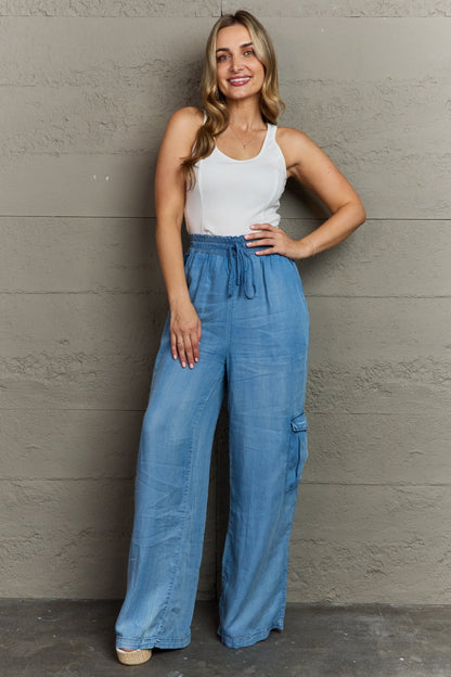 outfit view of women's soft denim cargo pants, wide leg, elastic waistband - paired with white tank top