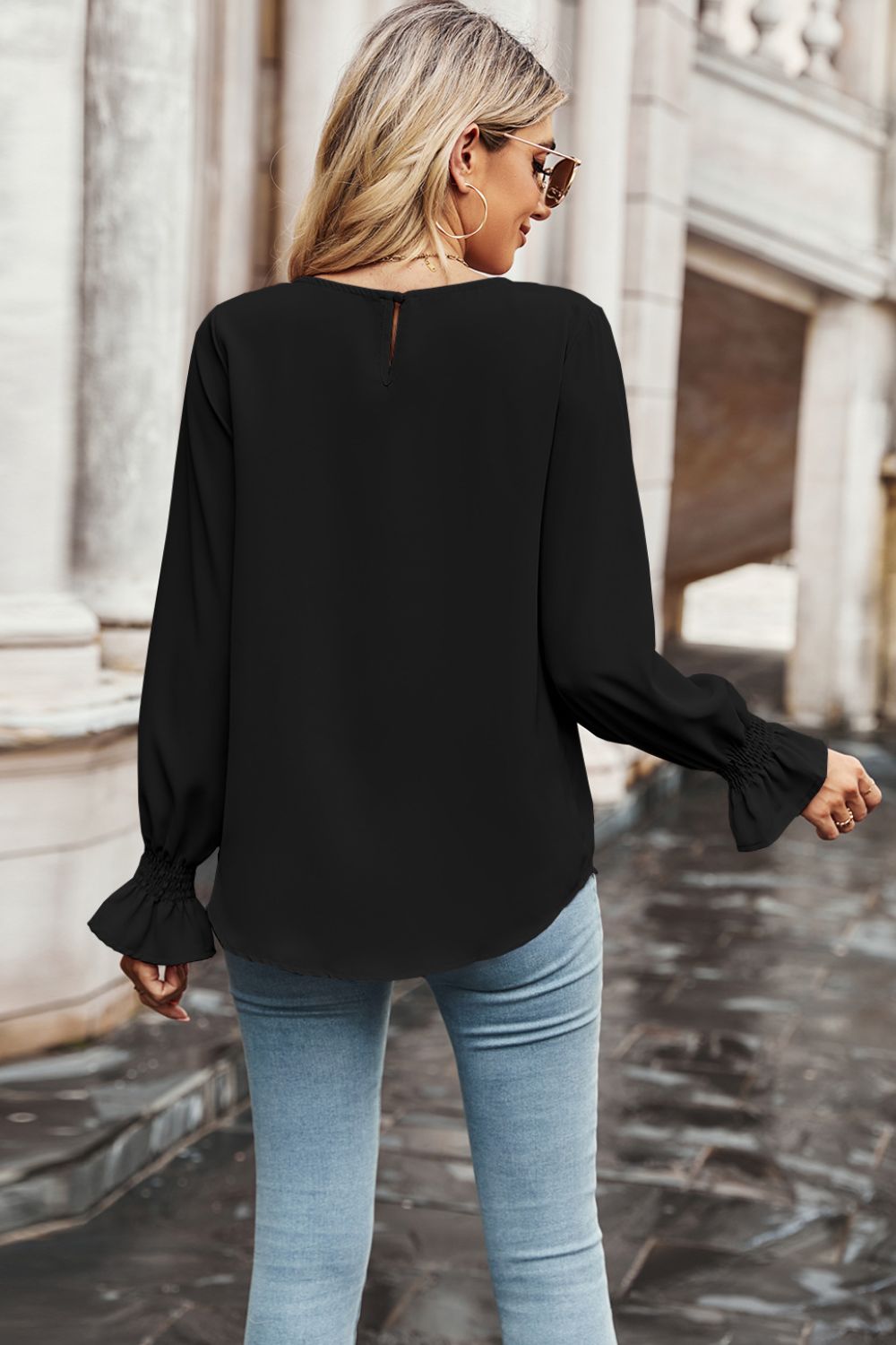 Women's Round Neck Long Flounce Sleeve Blouse with Smocked Wrists in Black, Rounded Hem Line in Front and Back