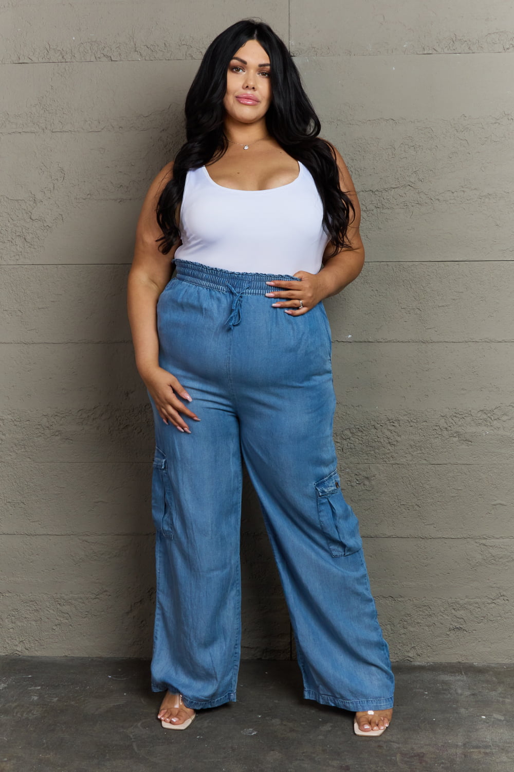 plus size woman model in soft denim cargo pants, wide leg, elastic waistband