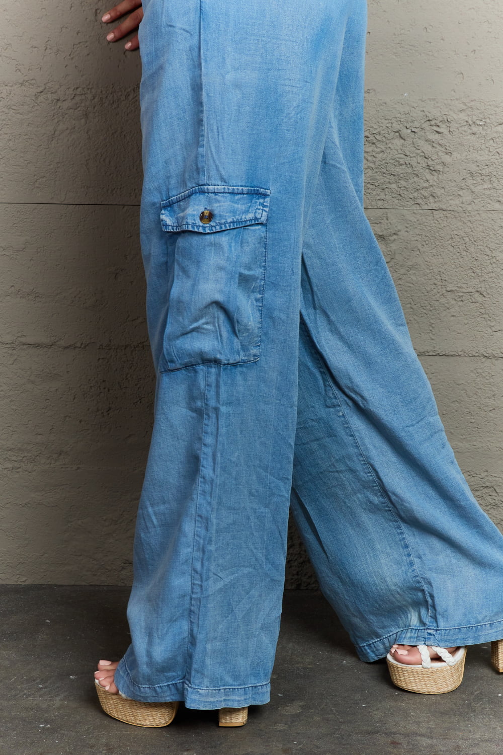 closeup of cargo pocket on soft denim cargo pants, loose wide leg pants with elastic waistband