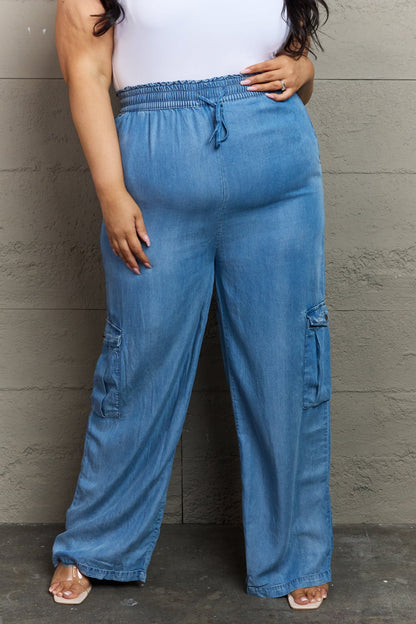women's plus size soft denim cargo pants with elastic waistband, loose wide leg style, cargo pockets on both sides