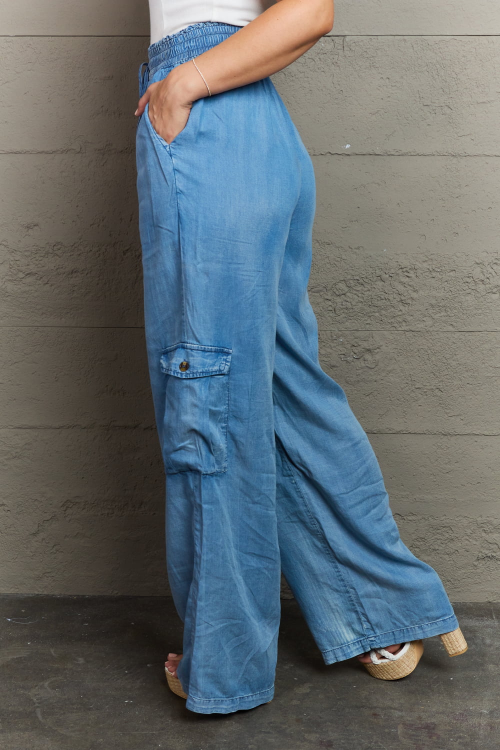 side view of women's soft denim cargo pants, wide leg, elastic waistband