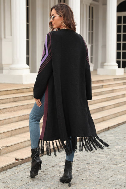 Back view Women's Long black open cardigan with fringed hem,  contrast trim, purple  geometric print on shoulders