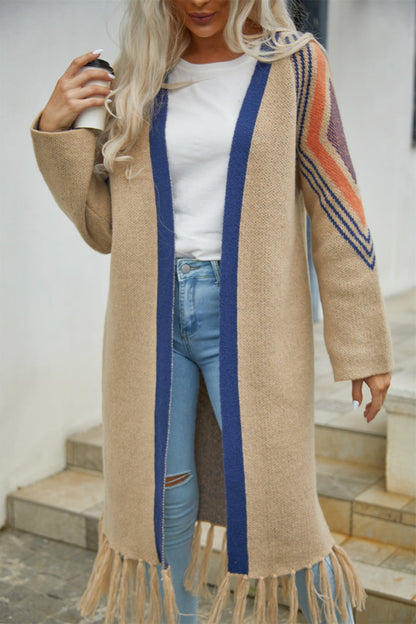 Women's Long Tan open cardigan with fringed hem, blue trim and blue and orange geometric print on shoulders
