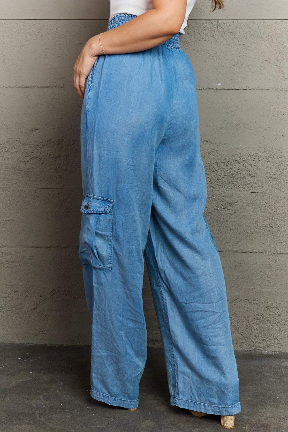 back view of soft denim cargo pants, wide leg, elastic waistband