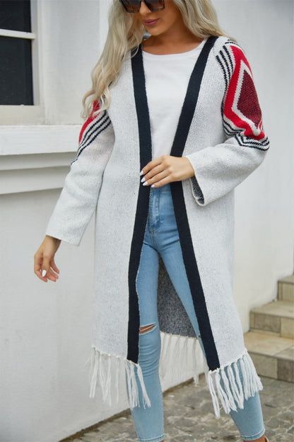 Women's Long white open cardigan with fringed hem, Black contrast trim, red and black  geometric print on shoulders